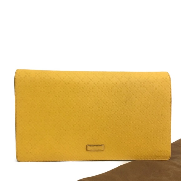 Gucci Handbags - Authentic Gucci Bright Diamanté Logo Yellow Leather Clutch Bag